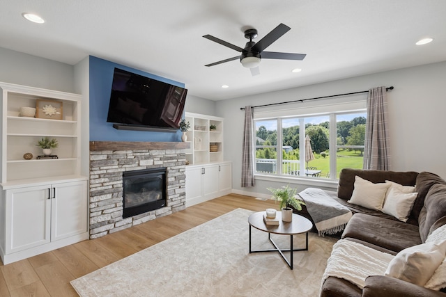 46140 Finch St, Mattawan, MI 49071 - living room with light wood finished floors, ceiling fan, a fireplace, and recessed lighting