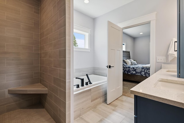 46140 Finch St, Mattawan, MI 49071 - bathroom featuring ensuite bath, double vanity, a bath, and recessed lighting