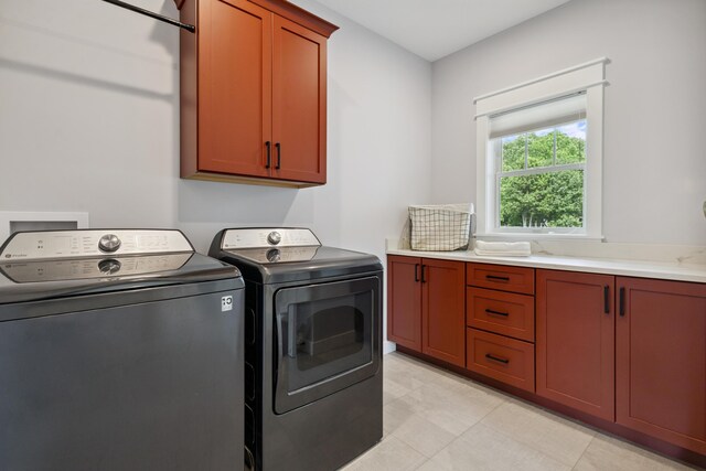 46140 Finch St, Mattawan, MI 49071 - laundry area with cabinet space, independent washer and dryer, and light tile patterned floors