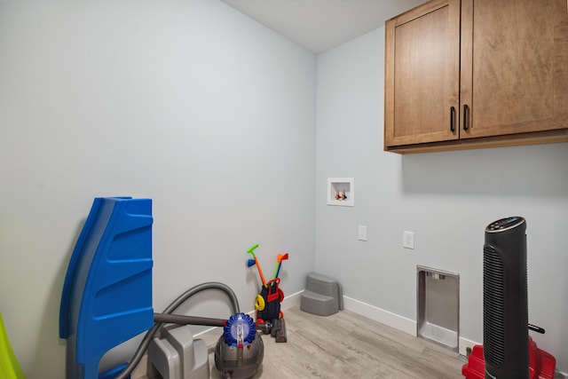 46140 Finch St, Mattawan, MI 49071 - washroom with cabinet space, wood finished floors, and washer hookup