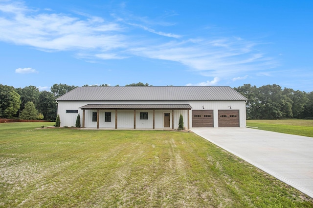 17756 Brad Ln, Three Rivers, MI 49093 - view of front of property with an attached garage, a front yard, concrete driveway, and a metal roof