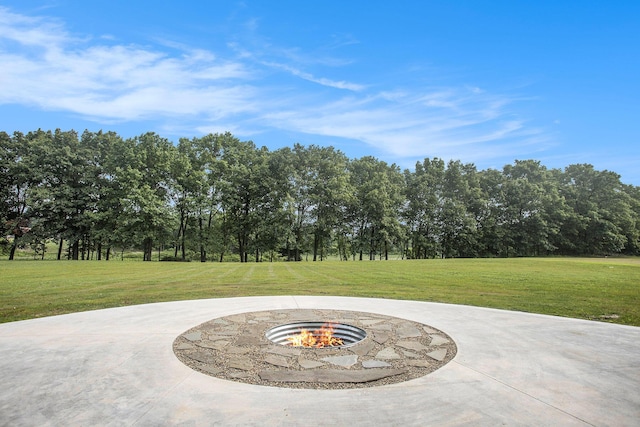 17756 Brad Ln, Three Rivers, MI 49093 - view of patio / terrace with a fire pit and view of wooded area