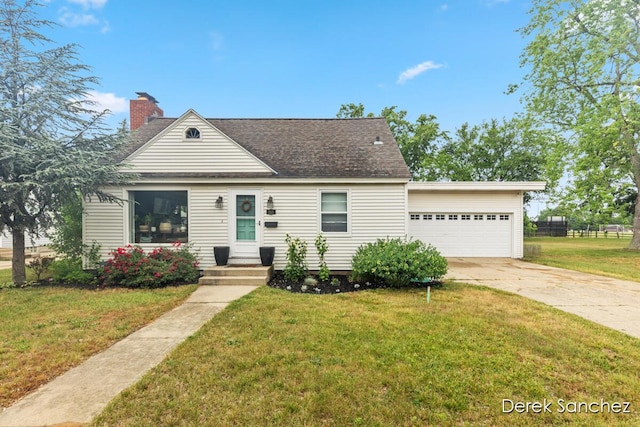 261 W 28th St, Holland, MI 49423 - view of front of property featuring driveway, an attached garage, a front lawn, and a chimney