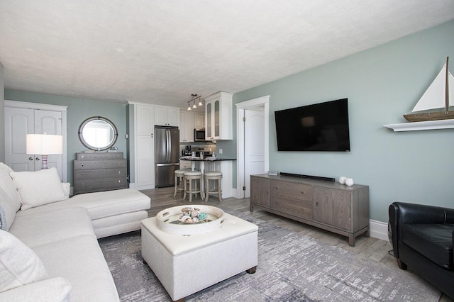 225 N Shore Dr Unit 302, South Haven, MI 49090 - living room with wood finished floors and baseboards