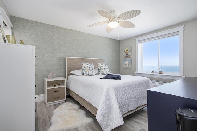 225 N Shore Dr Unit 302, South Haven, MI 49090 - bedroom with wood finished floors and a ceiling fan