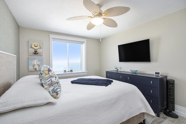 225 N Shore Dr Unit 302, South Haven, MI 49090 - bedroom with wood finished floors and ceiling fan