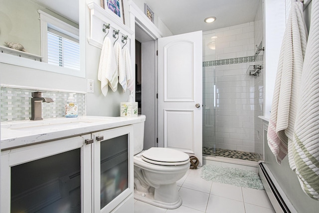225 N Shore Dr Unit 302, South Haven, MI 49090 - bathroom featuring a baseboard heating unit, tile patterned flooring, tiled shower, vanity, and recessed lighting