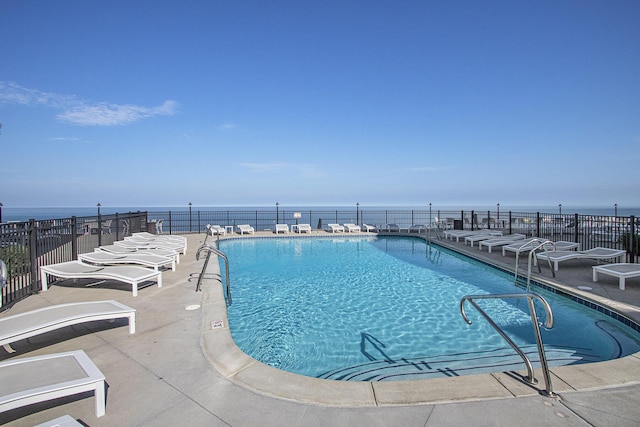 225 N Shore Dr Unit 302, South Haven, MI 49090 - community pool featuring a water view and a patio area