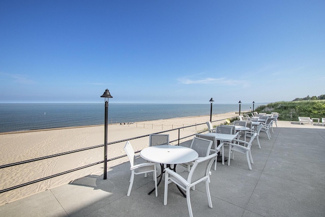 225 N Shore Dr Unit 302, South Haven, MI 49090 - view of patio / terrace featuring view of water and beach and outdoor dining space
