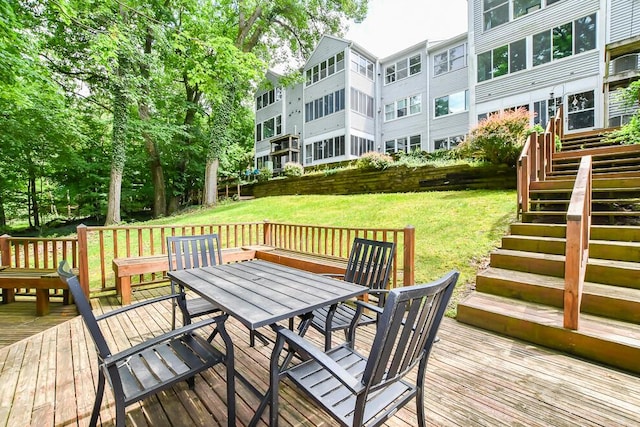 2208 Parkview Ave, Kalamazoo, MI 49008 - wooden terrace featuring outdoor dining area, stairs, and a lawn