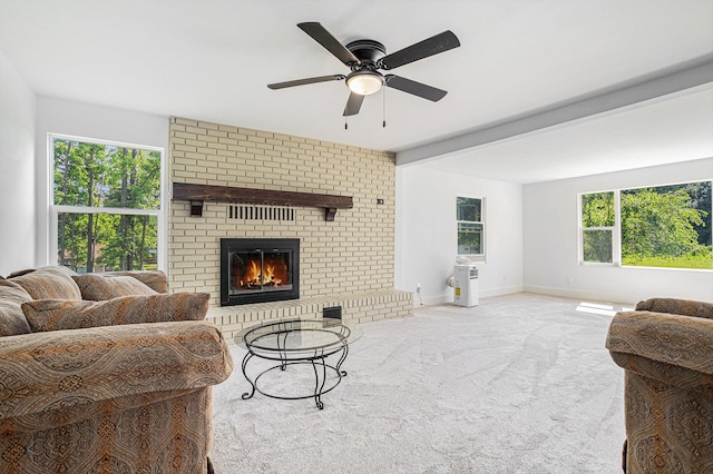 802 Clinton St, Marshall, MI 49068 - carpeted living room featuring ceiling fan and a fireplace
