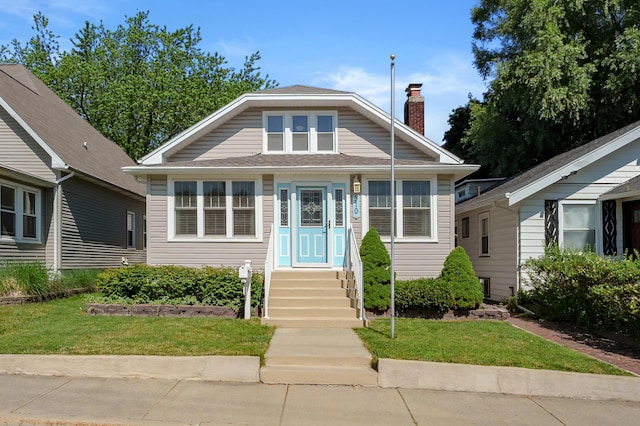 510 Wayne St, Saint Joseph, MI 49085 - bungalow-style home featuring a chimney and a front lawn