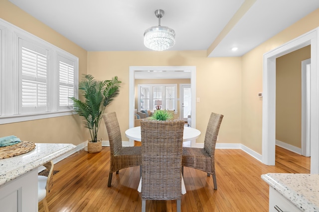 510 Wayne St, Saint Joseph, MI 49085 - dining space featuring light wood-type flooring and a chandelier