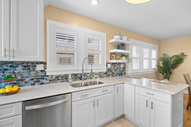 510 Wayne St, Saint Joseph, MI 49085 - kitchen with dishwasher, open shelves, light wood-style floors, and white cabinets