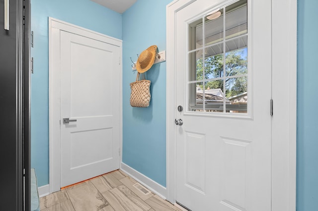 510 Wayne St, Saint Joseph, MI 49085 - doorway to outside featuring baseboards