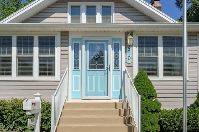 510 Wayne St, Saint Joseph, MI 49085 - view of exterior entry featuring a chimney