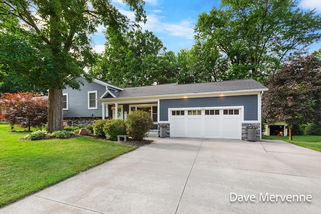 2845 Ridgecrest St SW, Byron Center, MI 49315 - tri-level home with stone siding, an attached garage, concrete driveway, and a front lawn