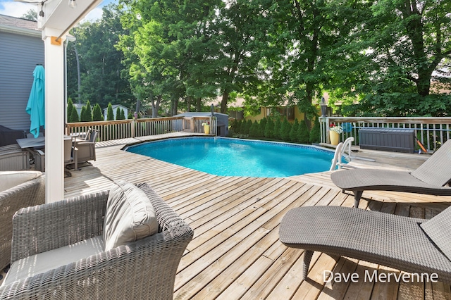 2845 Ridgecrest St SW, Byron Center, MI 49315 - view of pool featuring a wooden deck and a fenced backyard