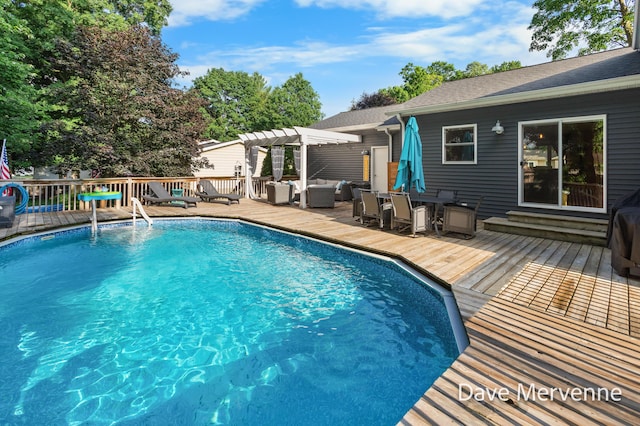 2845 Ridgecrest St SW, Byron Center, MI 49315 - outdoor pool with a pergola, a wooden deck, an outdoor hangout area, and outdoor dining space
