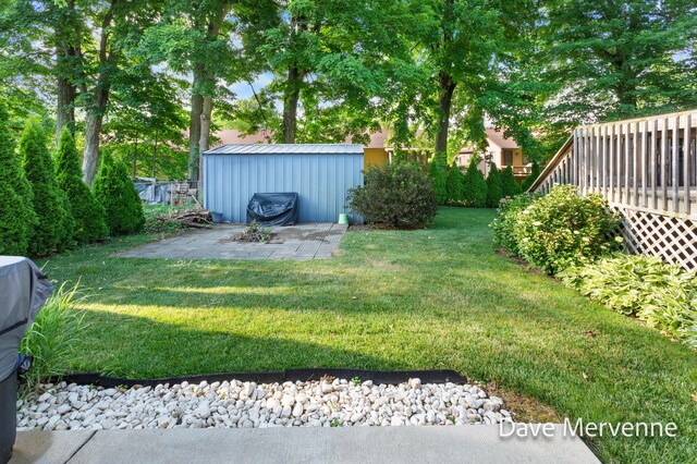 2845 Ridgecrest St SW, Byron Center, MI 49315 - view of green lawn with an outdoor structure and a deck