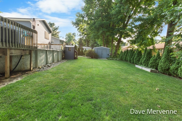 2845 Ridgecrest St SW, Byron Center, MI 49315 - view of green lawn featuring a shed and a deck
