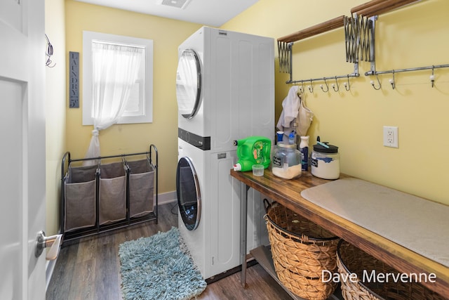 2845 Ridgecrest St SW, Byron Center, MI 49315 - washroom with stacked washing machine and dryer and wood finished floors