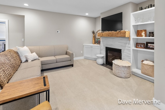 2845 Ridgecrest St SW, Byron Center, MI 49315 - carpeted living area with recessed lighting, a fireplace with flush hearth, and built in shelves