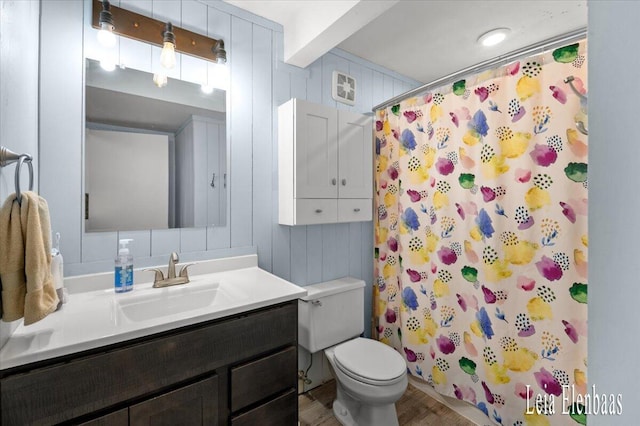 4712 Shank St NE, Rockford, MI 49341 - full bathroom featuring vanity, a shower with curtain, and wood finished floors