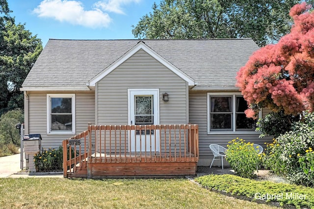 3725 Colby Ave SW, Wyoming, MI 49509 - bungalow with a deck, roof with shingles, and a front lawn