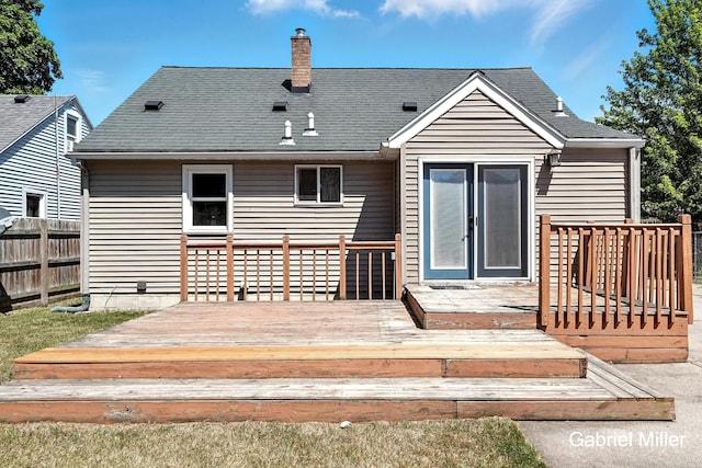 3725 Colby Ave SW, Wyoming, MI 49509 - back of house with a deck and a chimney