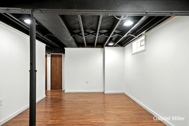 3725 Colby Ave SW, Wyoming, MI 49509 - below grade area with wood finished floors and baseboards