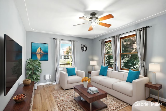 3725 Colby Ave SW, Wyoming, MI 49509 - living room with a ceiling fan and light wood-style floors
