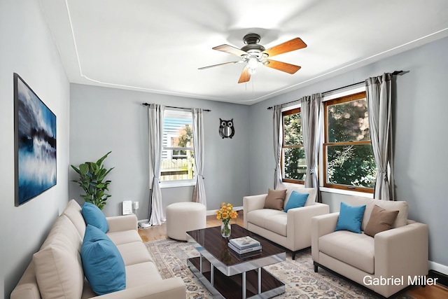 3725 Colby Ave SW, Wyoming, MI 49509 - living room featuring a ceiling fan and light wood-type flooring