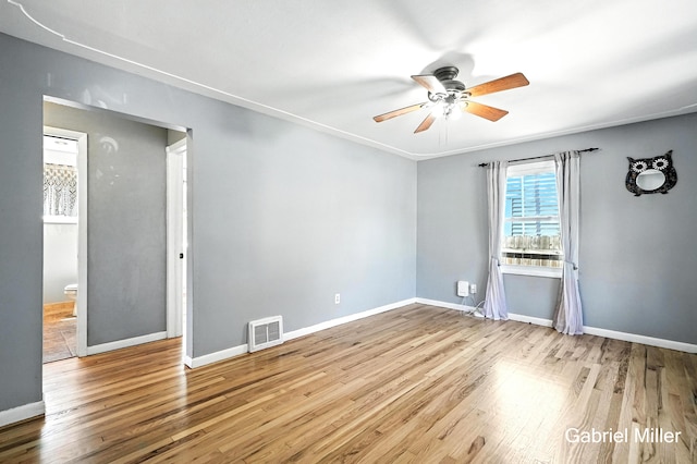 3725 Colby Ave SW, Wyoming, MI 49509 - spare room featuring a ceiling fan and wood finished floors