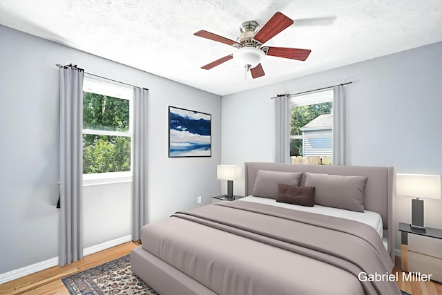 3725 Colby Ave SW, Wyoming, MI 49509 - bedroom with light wood-style flooring, a textured ceiling, and a ceiling fan