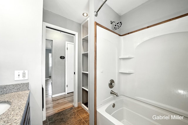 3725 Colby Ave SW, Wyoming, MI 49509 - full bath featuring shower / washtub combination, vanity, and tile patterned floors
