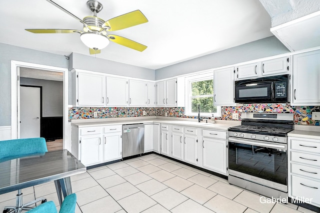 3725 Colby Ave SW, Wyoming, MI 49509 - kitchen with appliances with stainless steel finishes, light countertops, white cabinets, backsplash, and ceiling fan