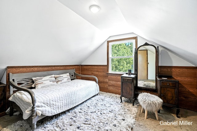 3725 Colby Ave SW, Wyoming, MI 49509 - carpeted bedroom with lofted ceiling and wood walls