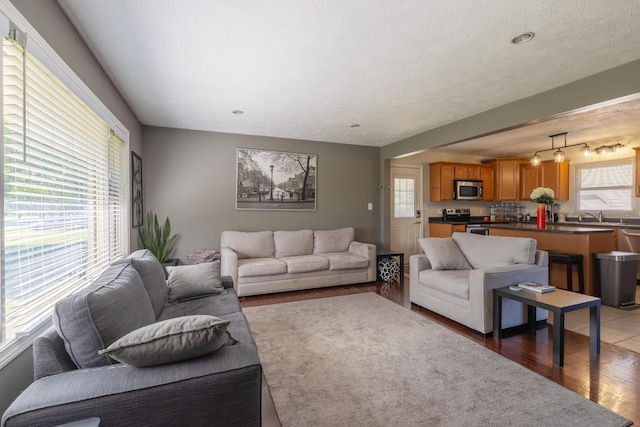 1762 Smyers Dr, Benton Harbor, MI 49022 - living room featuring healthy amount of natural light and light wood-style floors