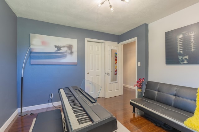 1762 Smyers Dr, Benton Harbor, MI 49022 - workout area with wood finished floors and baseboards