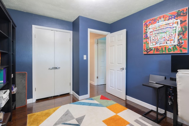 1762 Smyers Dr, Benton Harbor, MI 49022 - bedroom with wood finished floors, a closet, and a textured ceiling