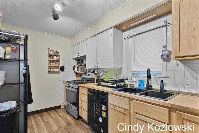 187 Centennial St, Sparta, MI 49345 - kitchen with gas stove, wooden counters, light wood-style floors, decorative backsplash, and a textured ceiling
