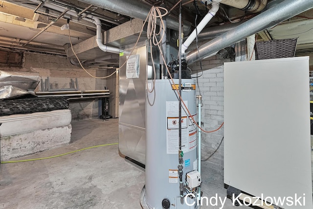 187 Centennial St, Sparta, MI 49345 - utility room featuring water heater