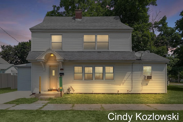 187 Centennial St, Sparta, MI 49345 - view of front facade featuring a front lawn, a chimney, and cooling unit