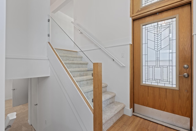 48002 Ridge Rd, New Buffalo, MI 49117 - entryway featuring stairs and light wood-style flooring