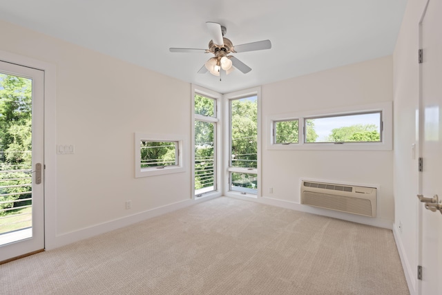 48002 Ridge Rd, New Buffalo, MI 49117 - carpeted spare room with a wall unit AC and a ceiling fan