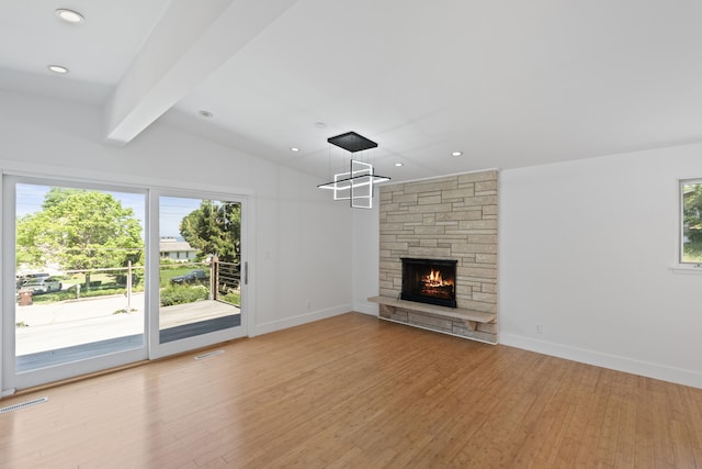 48002 Ridge Rd, New Buffalo, MI 49117 - unfurnished living room with wood finished floors, a fireplace, and recessed lighting