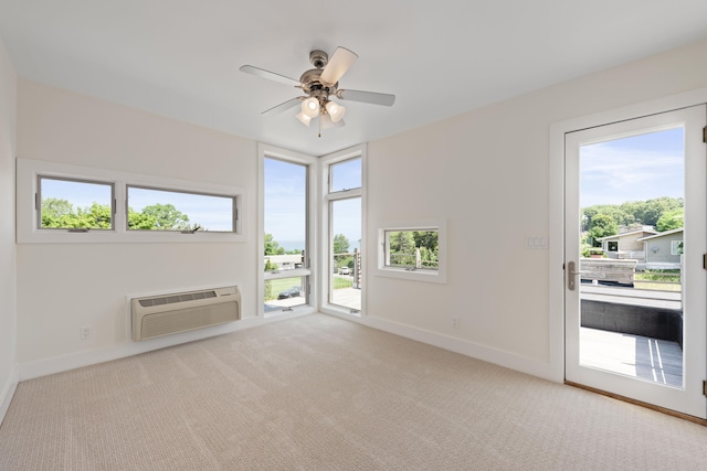 48002 Ridge Rd, New Buffalo, MI 49117 - unfurnished living room featuring healthy amount of natural light, ceiling fan, a wall mounted AC, and carpet floors