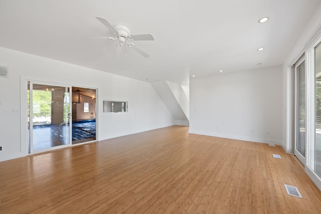 48002 Ridge Rd, New Buffalo, MI 49117 - unfurnished living room featuring light wood-style floors, a ceiling fan, and recessed lighting