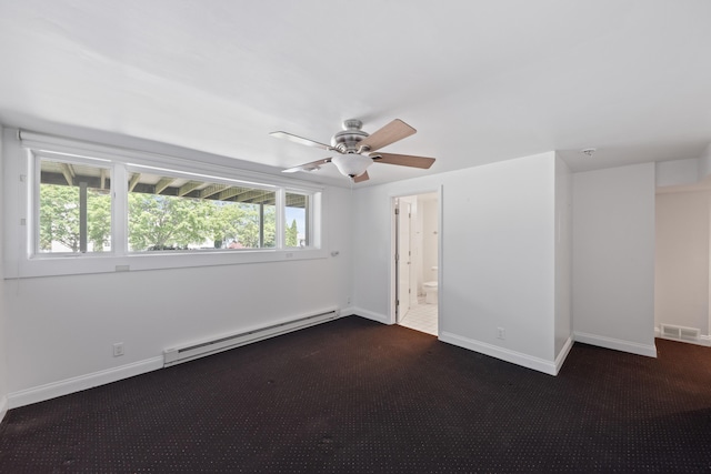 48002 Ridge Rd, New Buffalo, MI 49117 - empty room with a baseboard radiator, dark carpet, and a ceiling fan